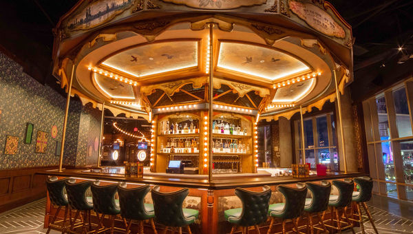 Dart boards encircle the 27-seat bar, which resembles an amusement park carousel.