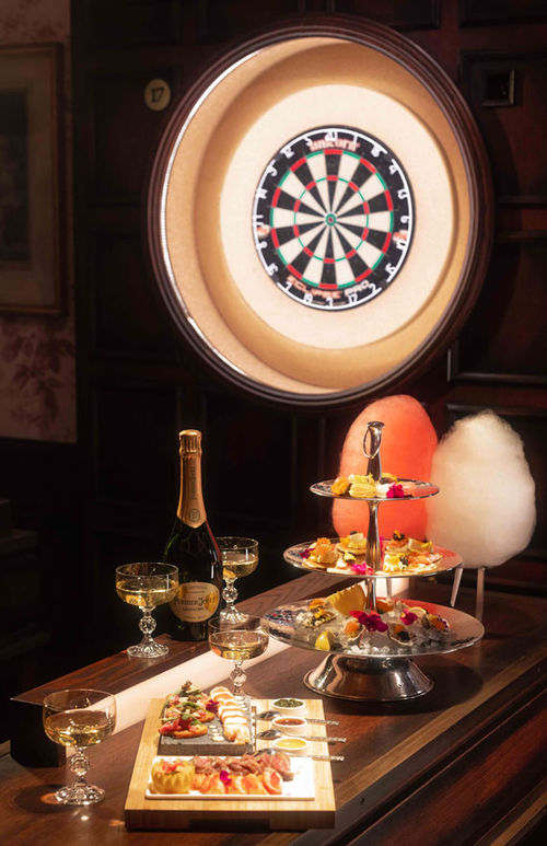 Guests are free to indulge in shareable bar bites and beverages in between rounds, or during rounds, at Flight Club Las Vegas. Guests are free to indulge in shareable bar bites and beverages in between rounds, or during rounds, at Flight Club Las Vegas.