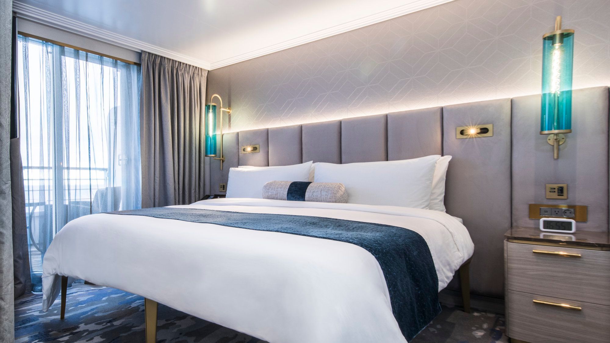 The bedroom in an Aquamarine Suite on the refurbished Crystal Serenity.