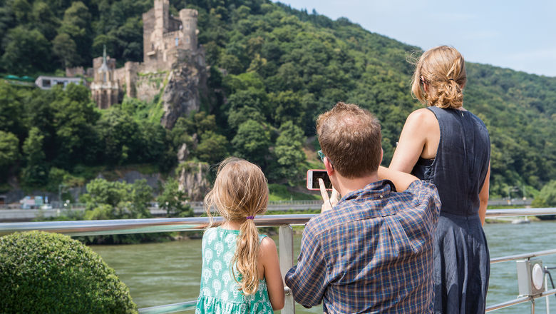A family enjoys the sites on a Uniworld Generations Collection river cruise on the Rhine.