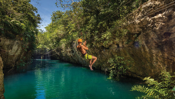 A ziplining guest at Grupo Xcaret's Xplor park.