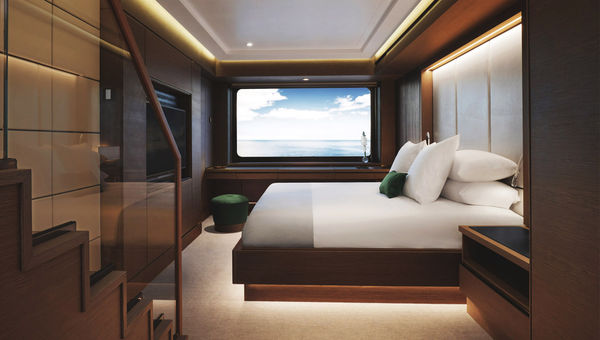 The lower level of a bilevel Loft Suite on the Evrima, with a staircase to the upper level at left. The lower level of a bilevel Loft Suite on the Evrima, with a staircase to the upper level at left.