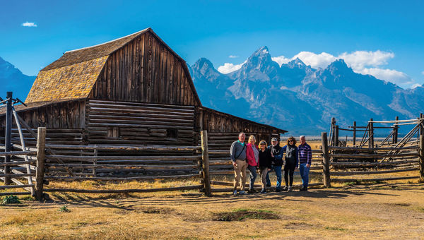 Guests on a Tauck small-group tour at the John Moulton Barn in Grand Teton National Park. Guests on a Tauck small-group tour at the John Moulton Barn in Grand Teton National Park.