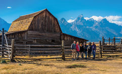 Guests on a Tauck small-group tour at the John Moulton Barn in Grand Teton National Park.