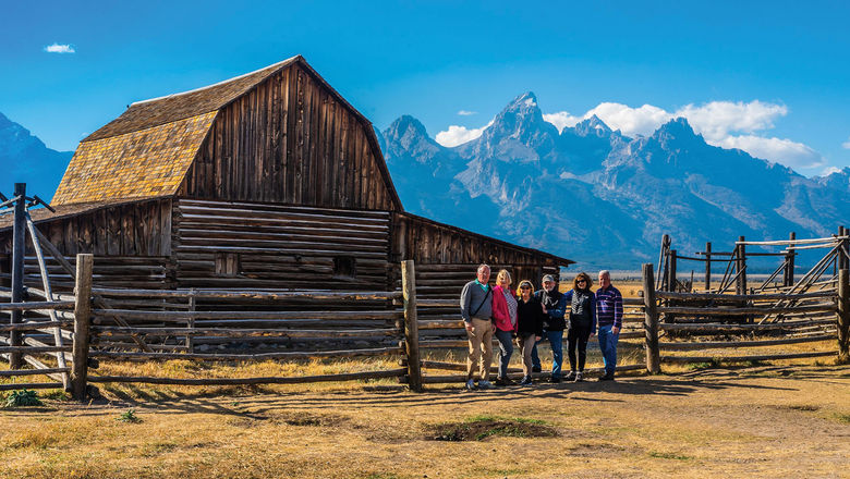 Guests on a Tauck small-group tour at the John Moulton Barn in Grand Teton National Park.