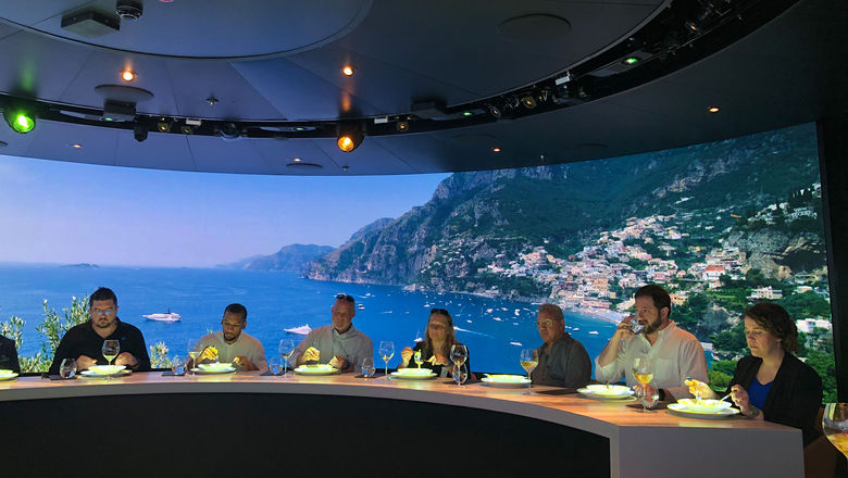 Scenes of the Amalfi Coast surround guests on their culinary journey.