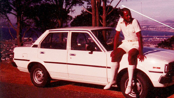 JR Harris, with his rental car, in Cape Town, 2011.  Around 1982.  Although he was repeatedly stopped by the police, his status as a 