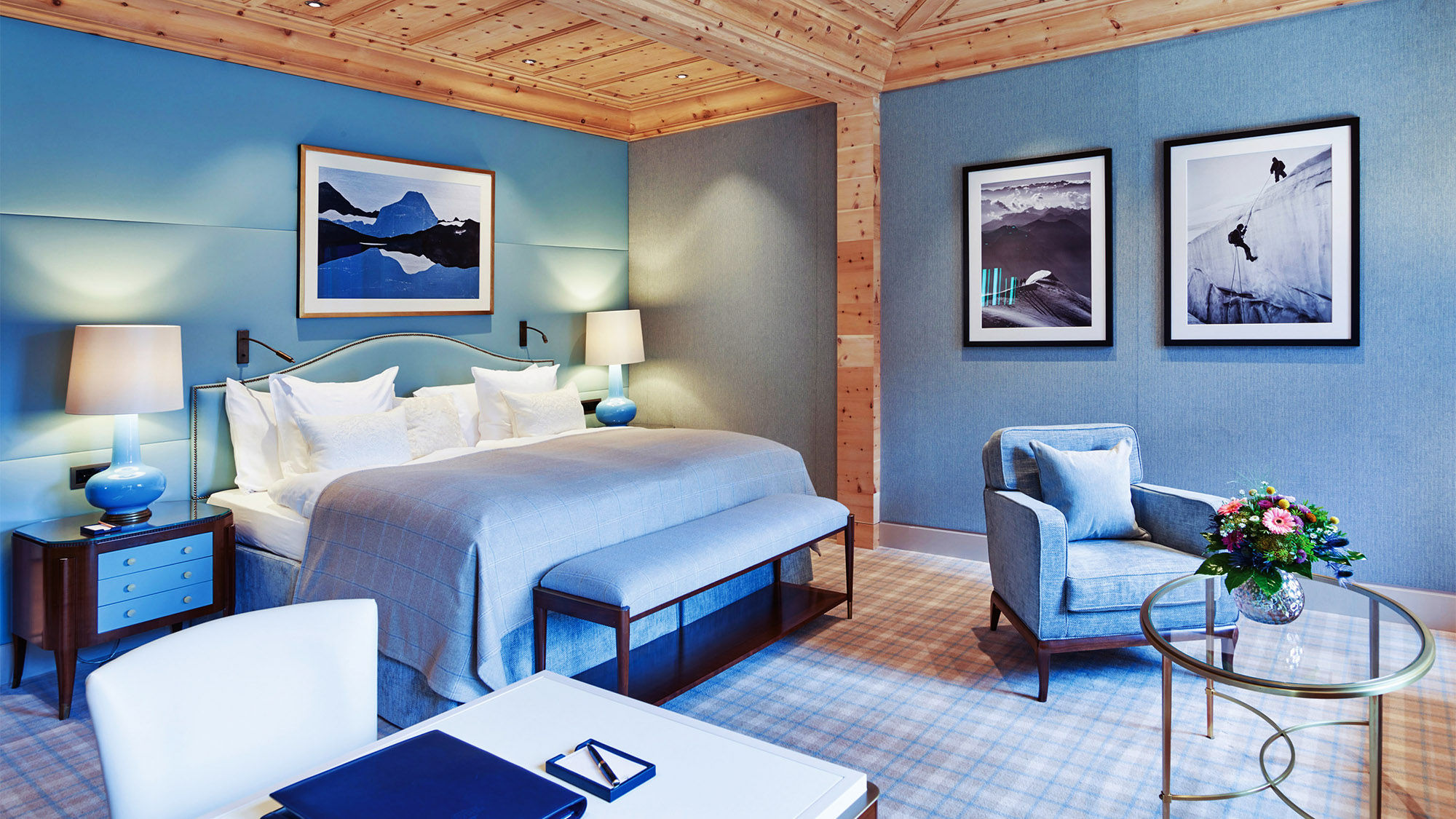 A Junior Suite at the Kulm Hotel St. Moritz with Swiss stone pine carved ceilings.