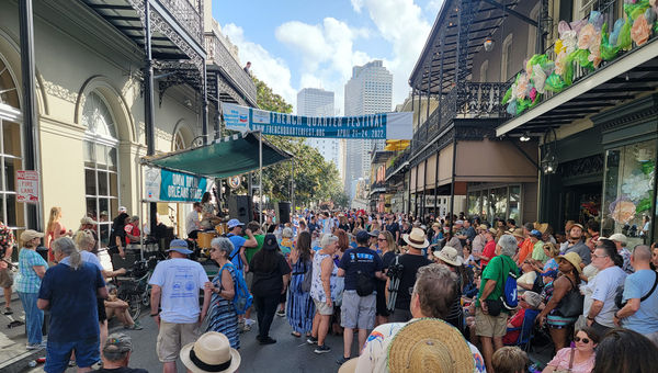 Crowd enjoys a performance at the Omni Royal Orleans stage at the 2022 French Quarter Festival. Hundreds of the city's top artists will entertain at this year's festival.
