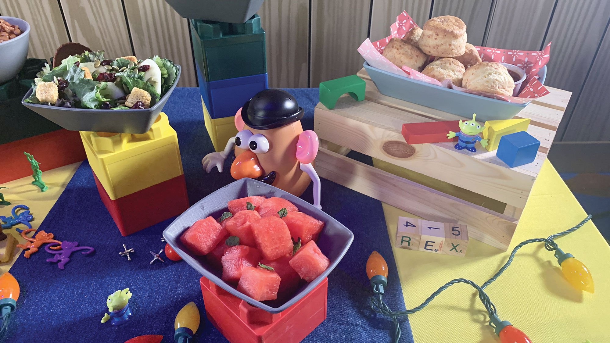 Roundup Rodeo BBQ starters include cheddar biscuits with sweet pepper jelly, romaine and kale salad, and watermelon with mint.