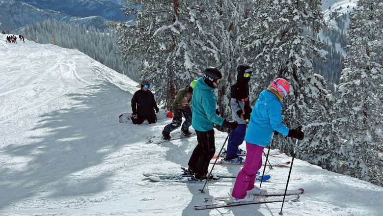 Skiers and boarders on a powder day at Utah’s Brighton Resort.