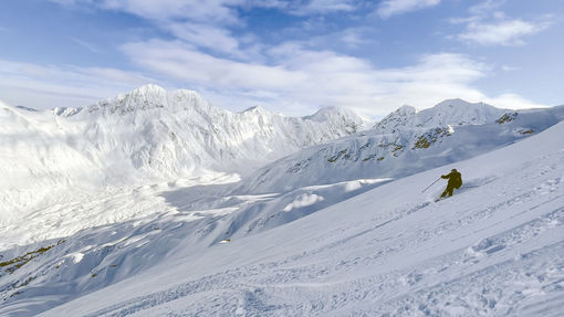 Travel Weekly's Robert Silk digs into a turn in Alaska's Chugach range.