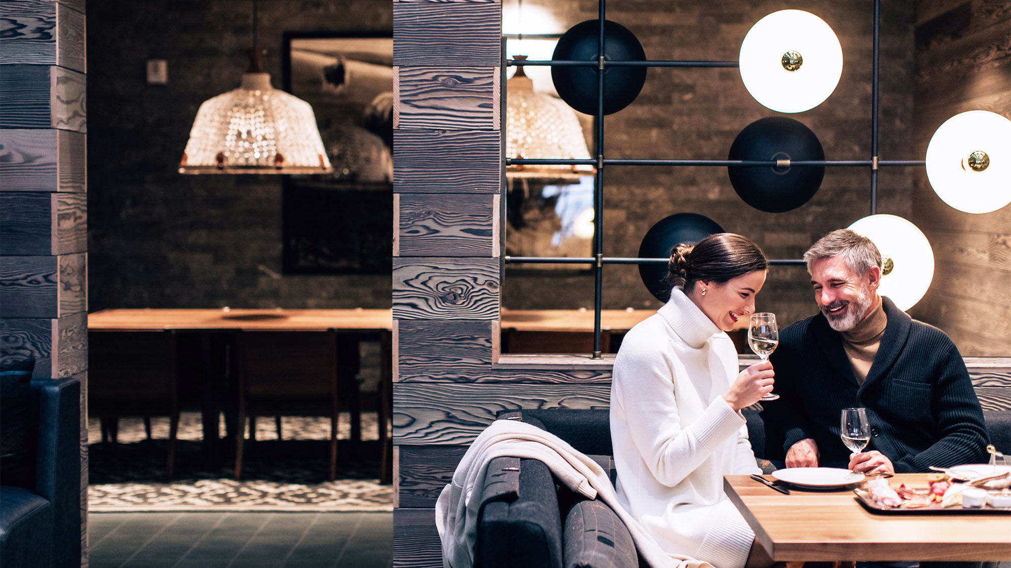 A couple enjoys a celebratory moment at The Hythe, a Luxury Collection Resort in Vail, Colorado.