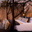 The Star Drift experience at Chiawa Camp features a four-course dinner served while drifting on the Zambezi River and a stay in the Star Bed Tower.