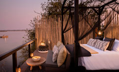 The Star Drift experience at Chiawa Camp features a four-course dinner served while drifting on the Zambezi River and a stay in the Star Bed Tower.