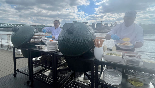 Riverside Mozart staff grill lunch for guests on the sun deck.
