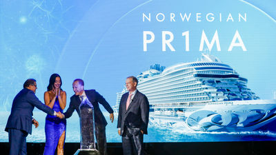 Norwegian Cruise Line Holdings CEO Frank Del Rio shook hands with Norwegian Cruise Line president and CEO Harry Sommer at the Norwegian Prima inaugural, with singer Katy Perry looking on.