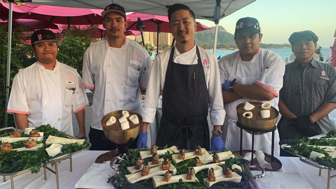 Chef Danny Chew and his team serve ahi tartare at an event.
