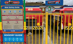 A sign at Legoland New York's Fire Academy attraction shows its sensory guide for families with autistic children.