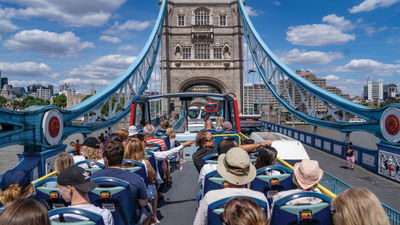 A Tootbus hop-on, hop-off bus gives a load of passengers a city tour of London.