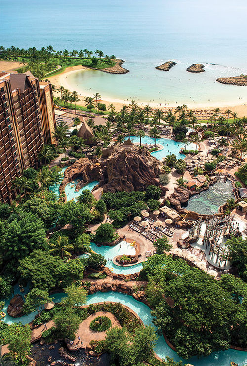 The Waikolohe main pool area at Aulani, a Disney Resort & Spa features slides, hot tubs, a lazy river and several pools.