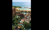 The Waikolohe main pool area at Aulani, a Disney Resort & Spa features slides, hot tubs, a lazy river and several pools.