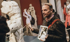A City Experiences guide leads a group through the Sistine Chapel in Vatican City.