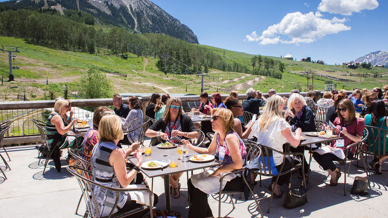 Summer guests dine on the deck of Butte 66 in Crested Butte, Colorado.