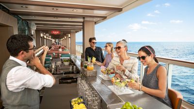 Guests at the Sugarcane Mojito Bar on the Norwegian Encore.