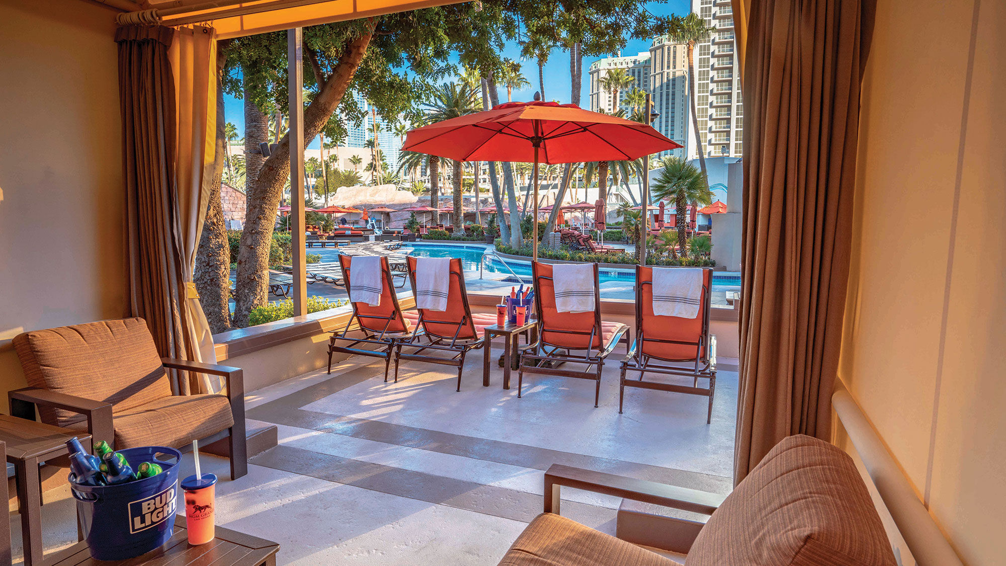 The pool deck at the MGM Grand as seen from one of the cabanas. A refreshed Dive Bar has four frozen drink machines with a walk-up area for ordering drinks.