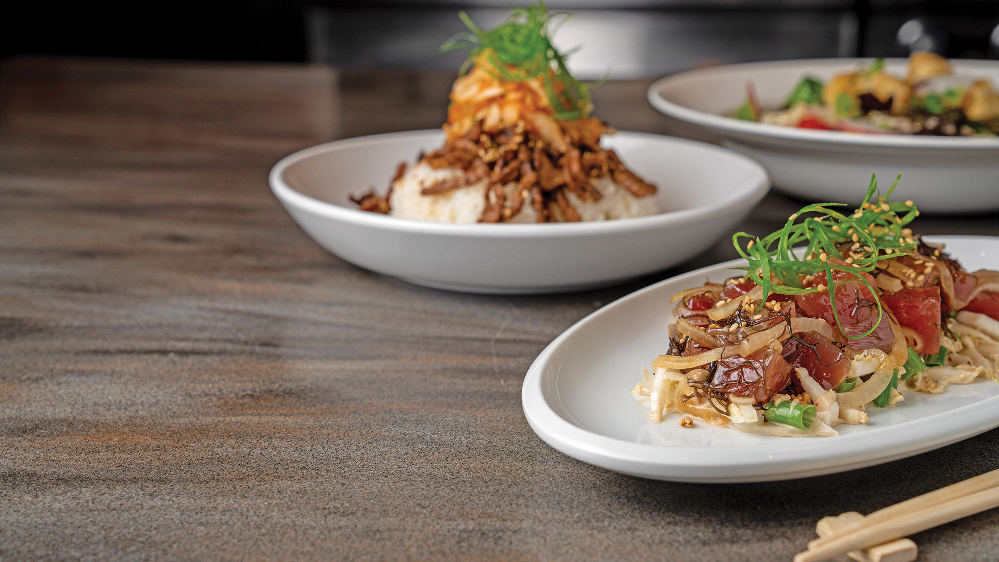 Ahi poke and other dishes served at Wai Kai's Lookout restaurant, which offers views of the wave pool and the watersports lagoon.