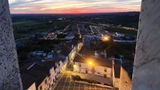 The white marble buildings of Estremoz from the Estremoz Castle as the sun sets.