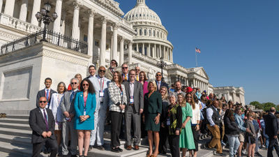 A group of delegates from US Travel's Destination Capitol Hill fly-in event in April gather on the Capitol steps.