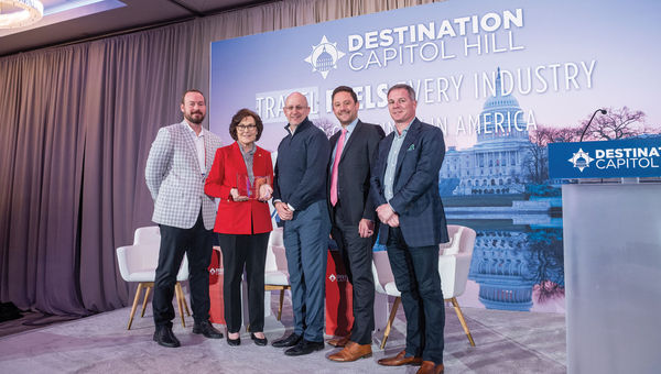 Sen. Jacky Rosen (D-NV), second from left, receives the Travel Champion award from U.S. Travel Association staff and members of the Nevada delegation.
