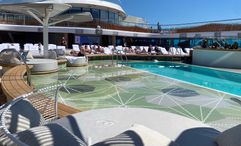 The pool deck on Oceania's Vista has a large tanning ledge where guests can walk, sit or sunbathe.