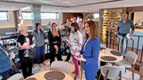 Andrea Kruse, COO and co-founder of Viva Cruises, addresses a group of North American journalists onboard the Viva Two.