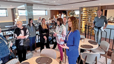 Andrea Kruse, COO and co-founder of Viva Cruises, addresses a group of North American journalists onboard the Viva Two.