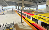 A Brightline train at the Brightline Orlando station, located at Orlando Airport.