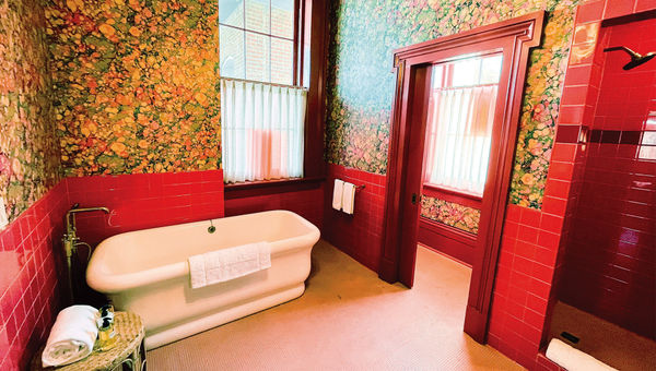 A colorful, eclectic bathroom is one of the centerpieces of Hotel Saint Vincent's Mary Suite accommodation. A colorful, eclectic bathroom is one of the centerpieces of Hotel Saint Vincent's Mary Suite accommodation.