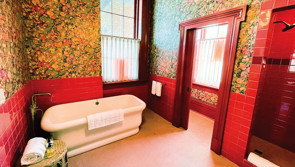 A colorful, eclectic bathroom is one of the centerpieces of Hotel Saint Vincent's Mary Suite accommodation.