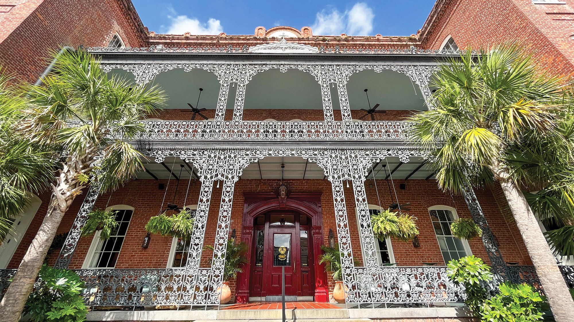 Wrought iron dominates the entrance of the Hotel Saint Vincent in New Orleans.