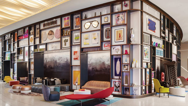 Contemporary art fills the gallery wall of the entire lobby at the Lake Nona Wave Hotel.