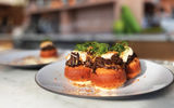 Oxtail Beignets served at MaryGold's, the resident restaurant of the Arlo Wynwood Hotel.