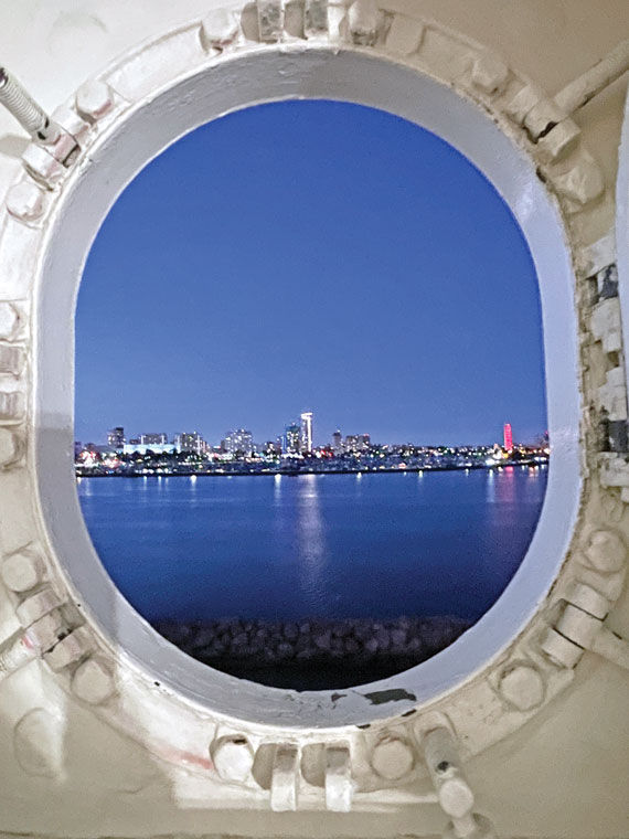 The lights of Long Beach viewed through a stateroom porthole on the Queen Mary.