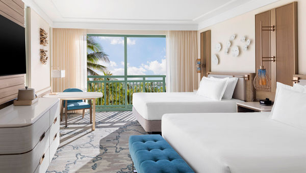 A room at Atlantis Paradise Island in the Bahamas. The resort updated its rooms in its Royal Towers with teal armchairs, plush carpeting and art made from natural materials. A room at Atlantis Paradise Island in the Bahamas. The resort updated its rooms in its Royal Towers with teal armchairs, plush carpeting and art made from natural materials.