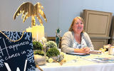 Tina Bradley of Wish You Were Here Vacations in Winter Haven, Fla., was a winner of GTM table design, she said (there was no official competition this year). Her sign says "happiness comes in waves" -- and yes, she sells cruises.