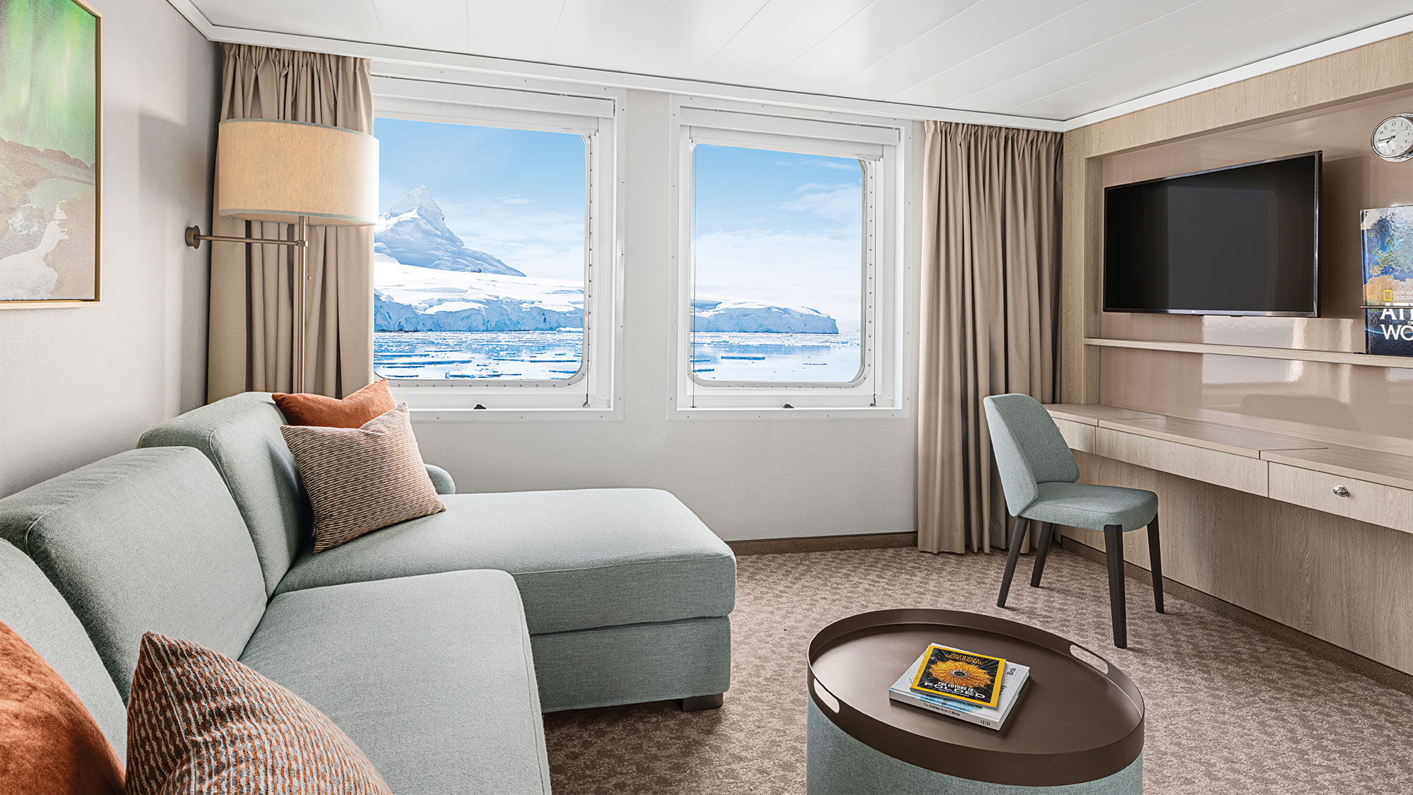 The living room of a redesigned Category 6 suite on the National Geographic Explorer.