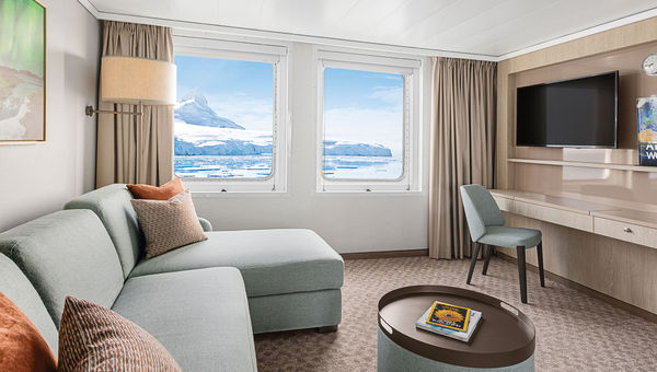 The living room of a redesigned Category 6 suite on the National Geographic Explorer. The living room of a redesigned Category 6 suite on the National Geographic Explorer.