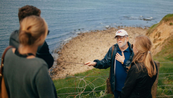 An EF Go Ahead Tours group visiting the beaches of Normandy.