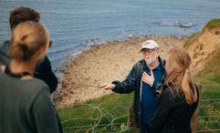 An EF Go Ahead Tours group visits the beaches of Normandy.